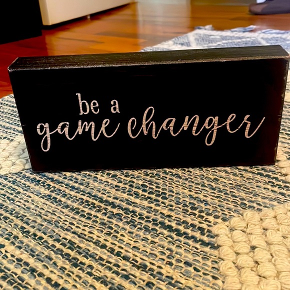 Wooden, black encouraging sign that says “be a game changer” in white. - Picture 1 of 3